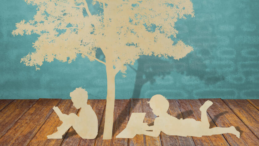 Paper cut of children read a book under tree