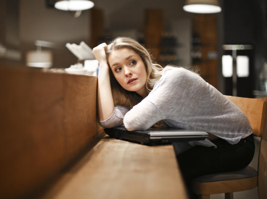 portrait of a girl with a computer in a cafe